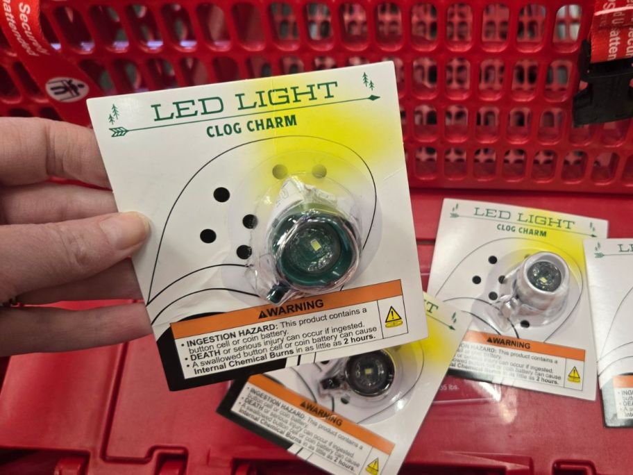 LED Light Clog Charm package in hand in store