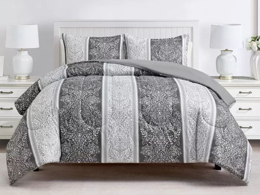 dark and light grey striped Sunham Linden 3-Piece Comforter Set on bed in bedroom