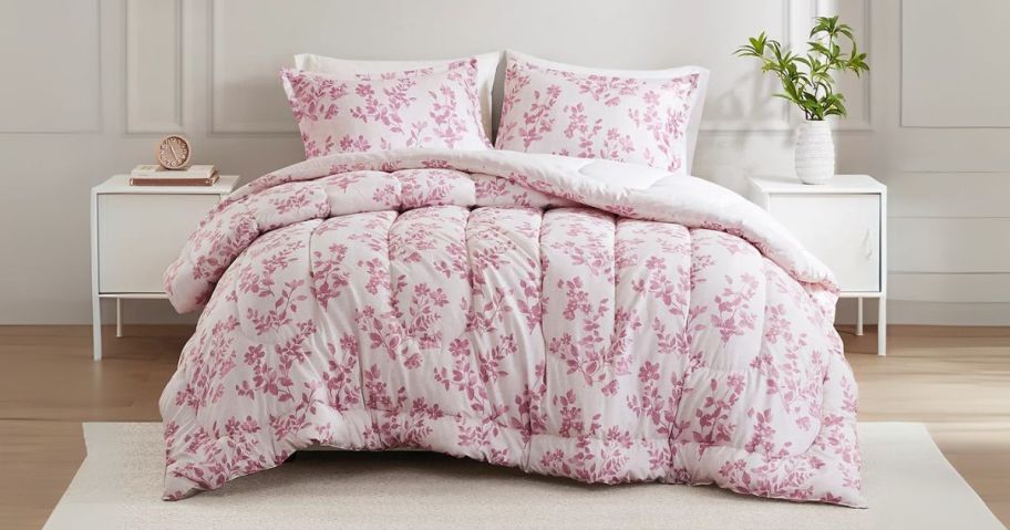 pink and white Addison Park Amelia 3-Piece Comforter Set on bed in bedroom