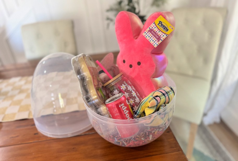 jumbo plastic easter egg used as an easter basket and filled with gifts
