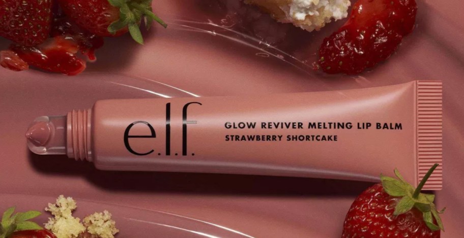 elf lip balm surrounded by strawberries