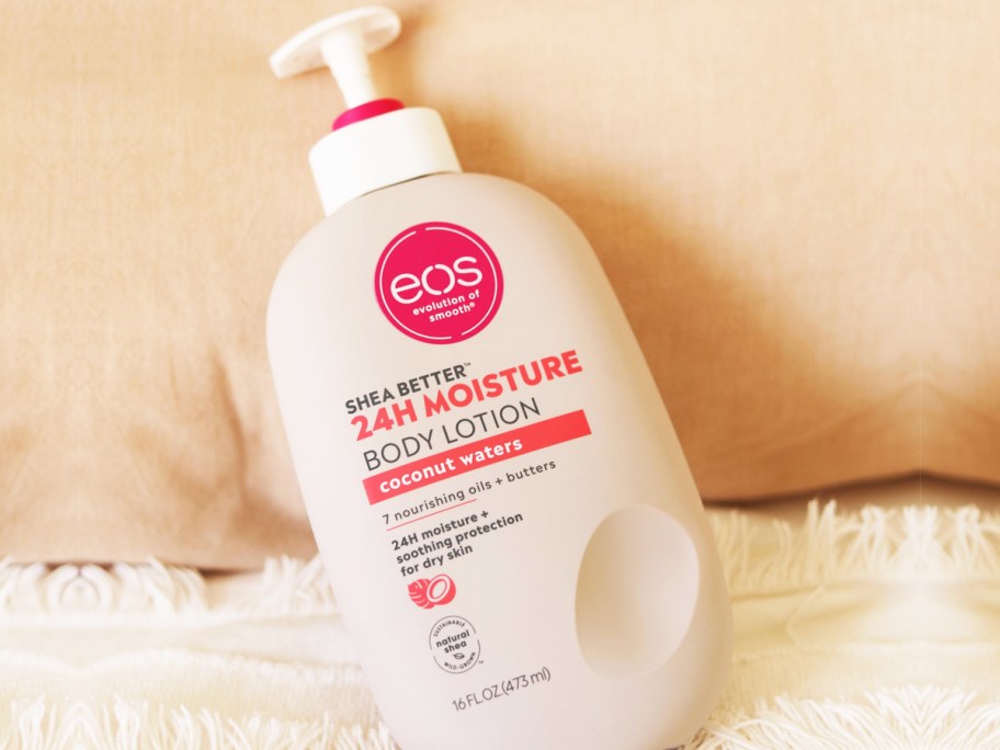 bottle of eos Shea Better Coconut Waters Body Lotion on bed