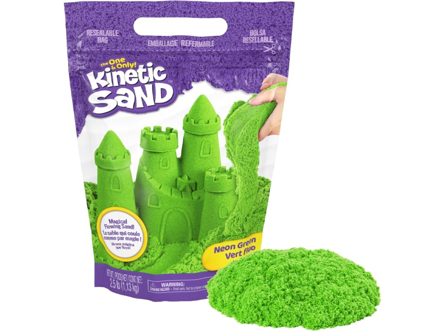 kinetic sand bag with green sand in front of it 