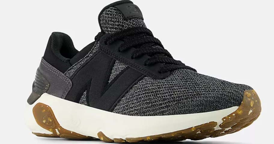 a black, grey, and white women's New Balance running shoe