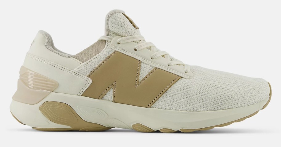 an off white and tan color men's New Balance shoe