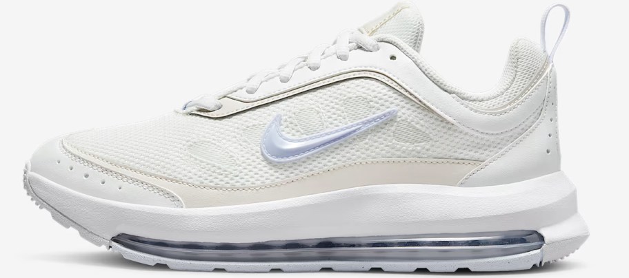 white and light purple nike shoe