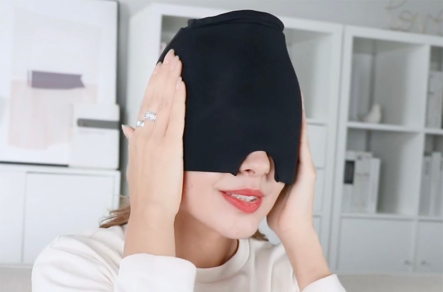 woman wearing a migraine relief cap on her head