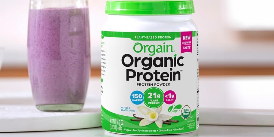 orgain protein powder container on counter