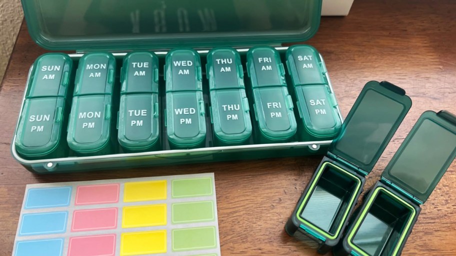 green pill organizer with accessories on a table
