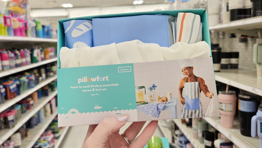 hand holding pillowfort boys apron set