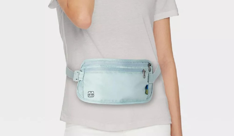 woman wearing a blue rfid waist pouch