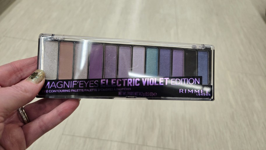 hand holding a rimmel eyeshadow palette