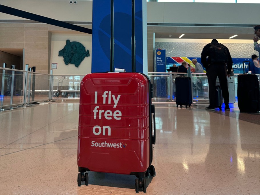 red luggage at Southwest counter