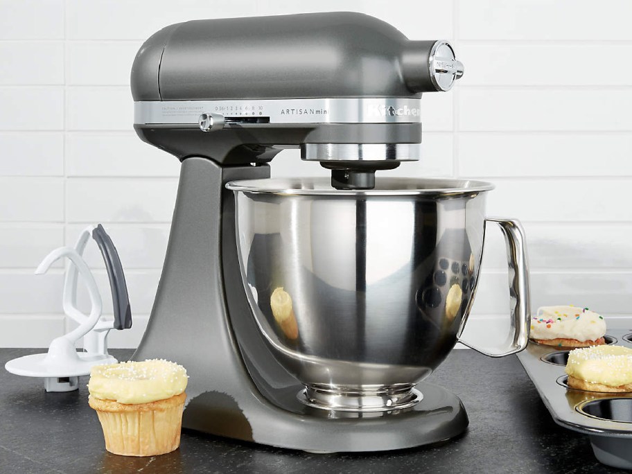 silver standing mixer with cupcakes on the side