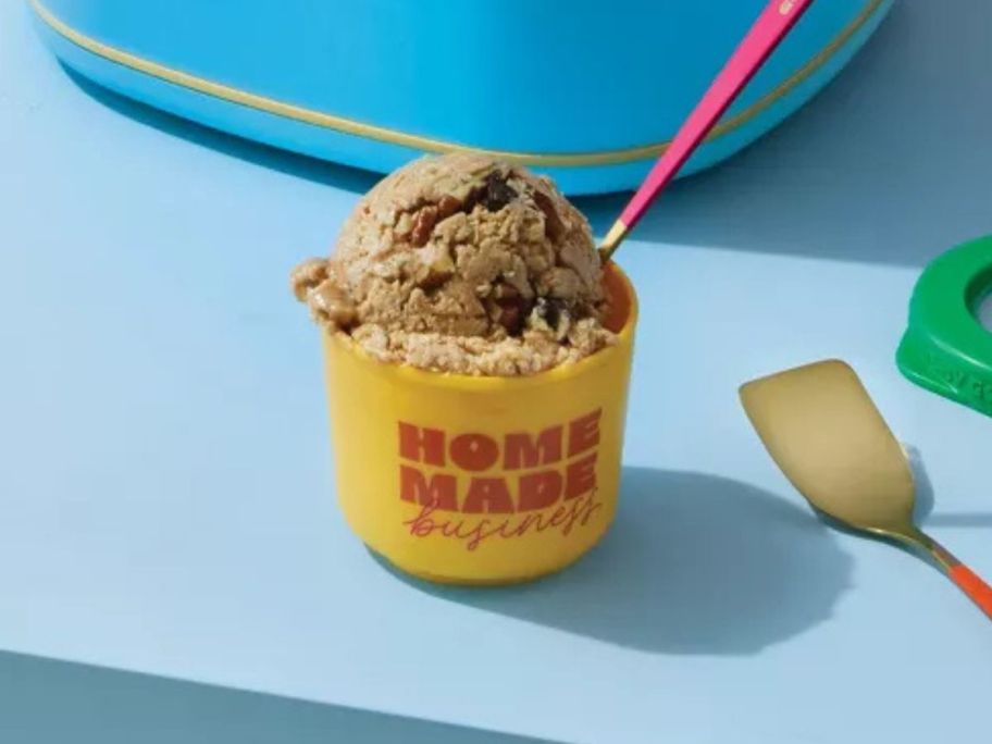 yellow and red Tabitha Brown 4-Pack Mini Ice Cream Container filled with ice cream on counter