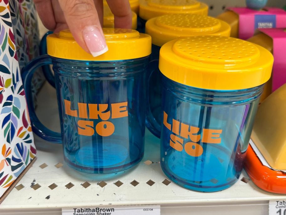 orange and blue Tabitha Brown Single Seasoning Shakers on shelf in store