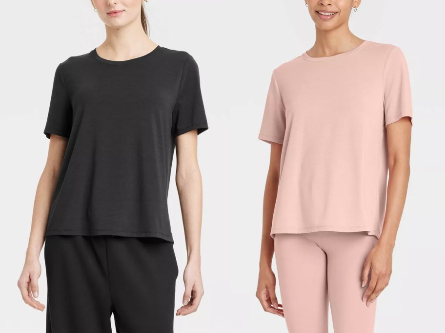 two women wearing black and pink shirts