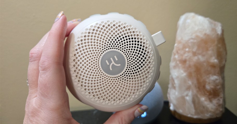 hand holding white noise machine