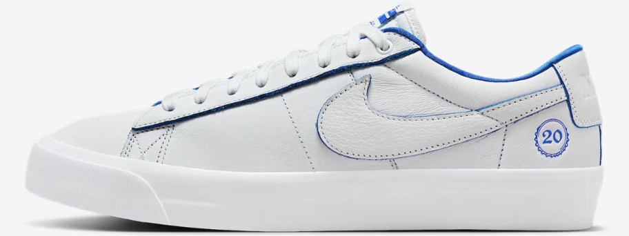 a white with blue accents Nike Blazer style shoe