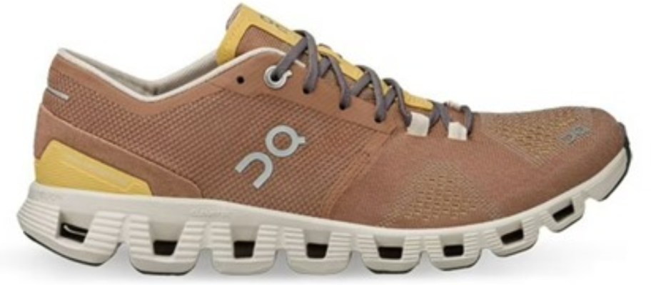 a tan, yellow ,and white On running shoe