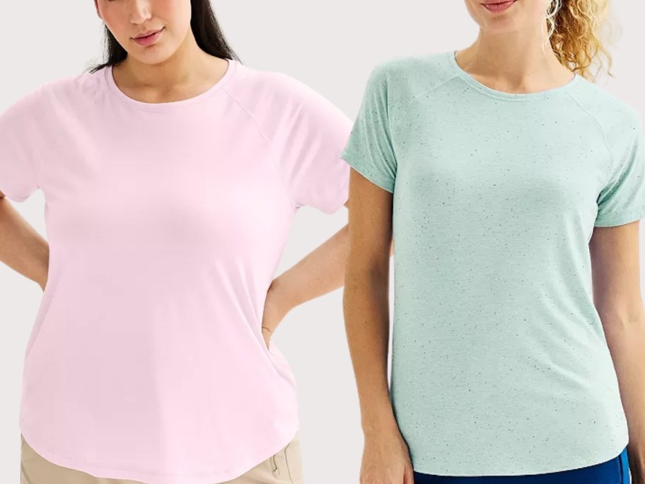 woman wearing a pink tee and woman wearing a green tee