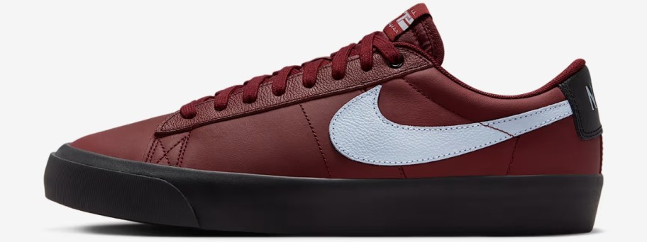 a burgundy, white, and black Nike Blazer low shoe