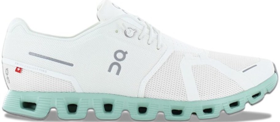 a white and mint green On running shoe
