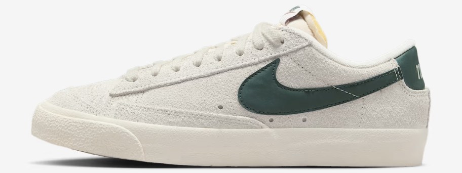 a Nike Blazer low style shoe in white with green accents