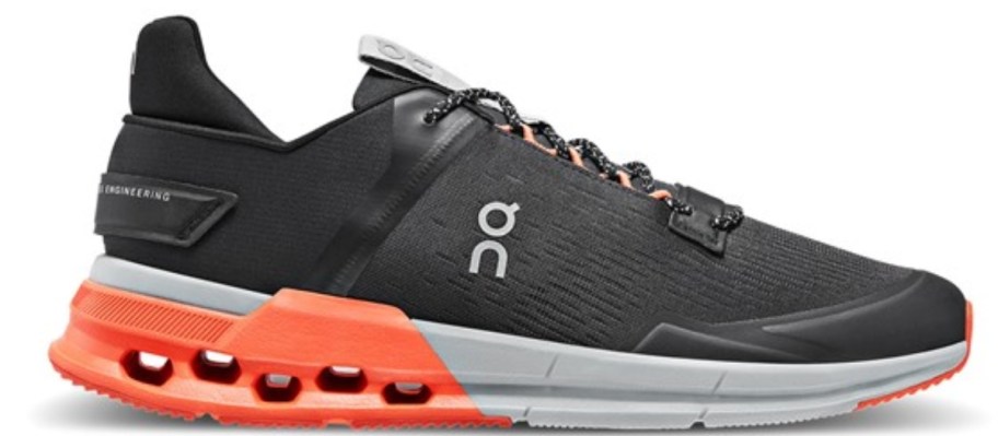 a black, grey, and orange On running shoe