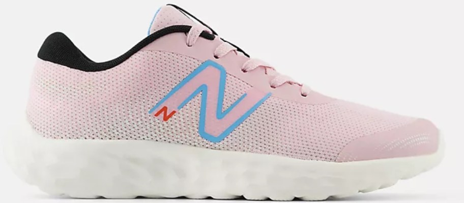  a pink and white kid's New Balance sneaker