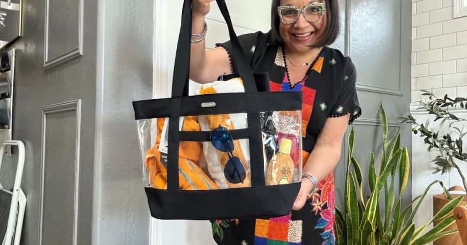 A woman holding a Baggallini Tote Bag