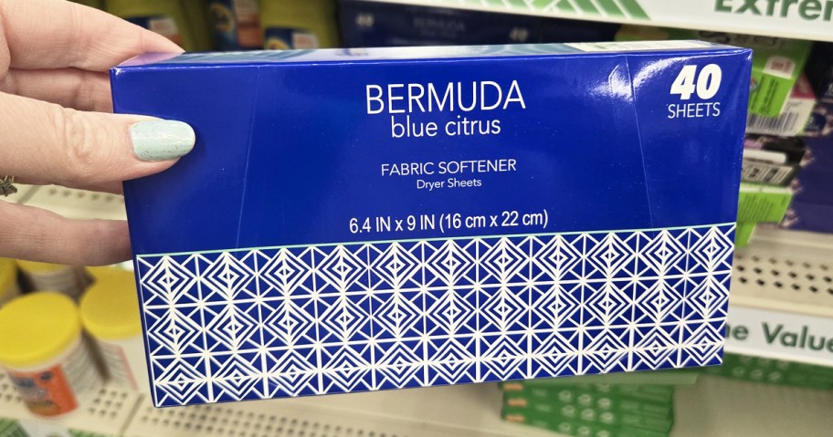 hand holding up a blue box of Bermuda Blue Citrus Fabric Softener Dryer Sheets in store