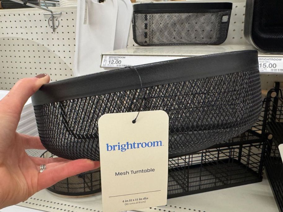 Hand holding a Brightroom 11" Metal Mesh Turn Table