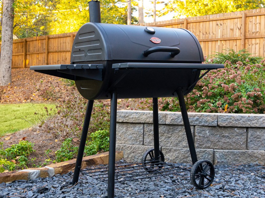 black barrel grill in backyard