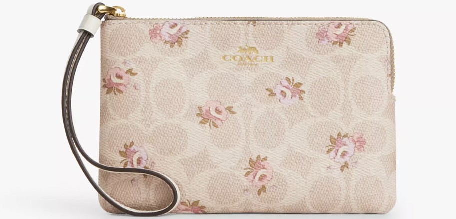 beige coach wristlet with rose print