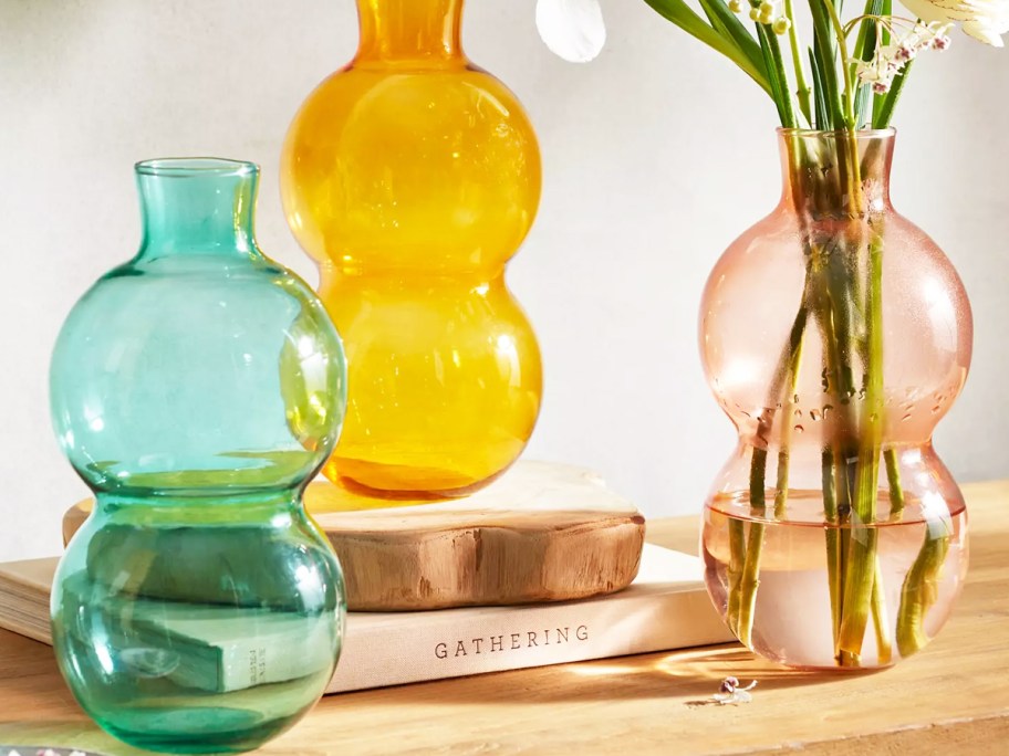 teal, yellow, and pink glass bubble bud vases