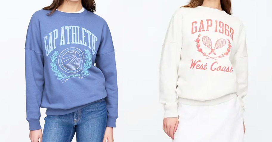 two women in blue and white graphic crewneck sweatshirts