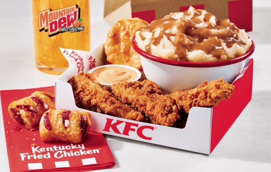 a kfc fill up box shown with a peach soda