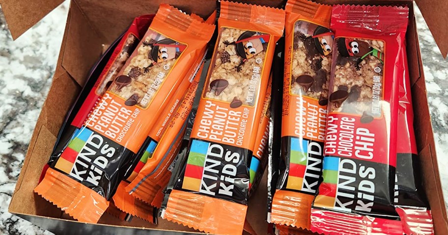 orange and red KIND chewy bars in cardboard box