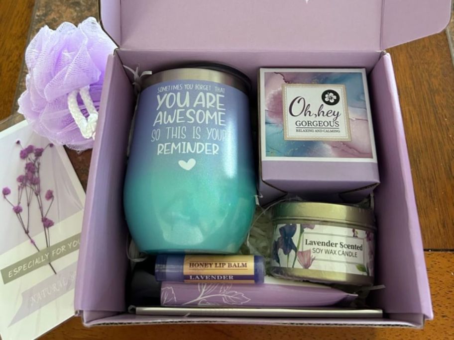 A Spa Gift Set box in Purple with various self-care items in it