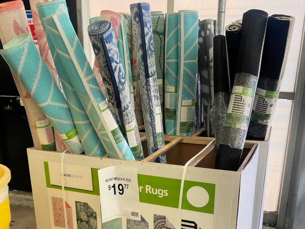 In-store display of mainstays outdoor rugs inside Walmart store
