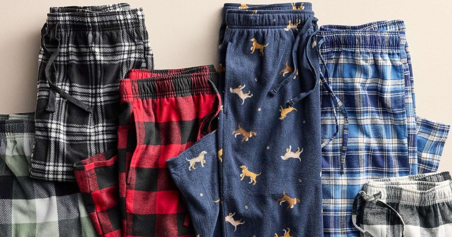 multiple folded pairs of mens plaid pajama pants