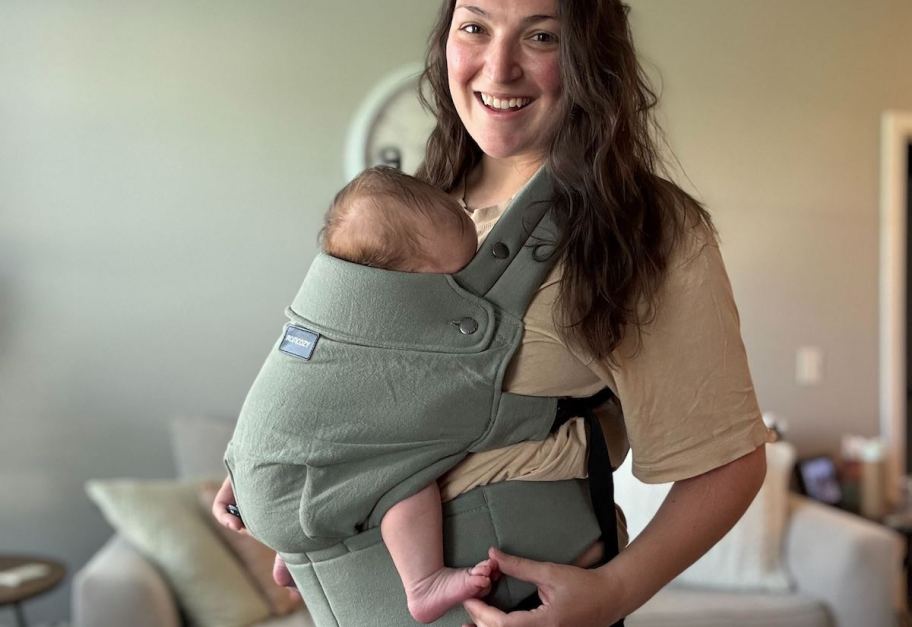 woman holding baby in Momcozy Carrier