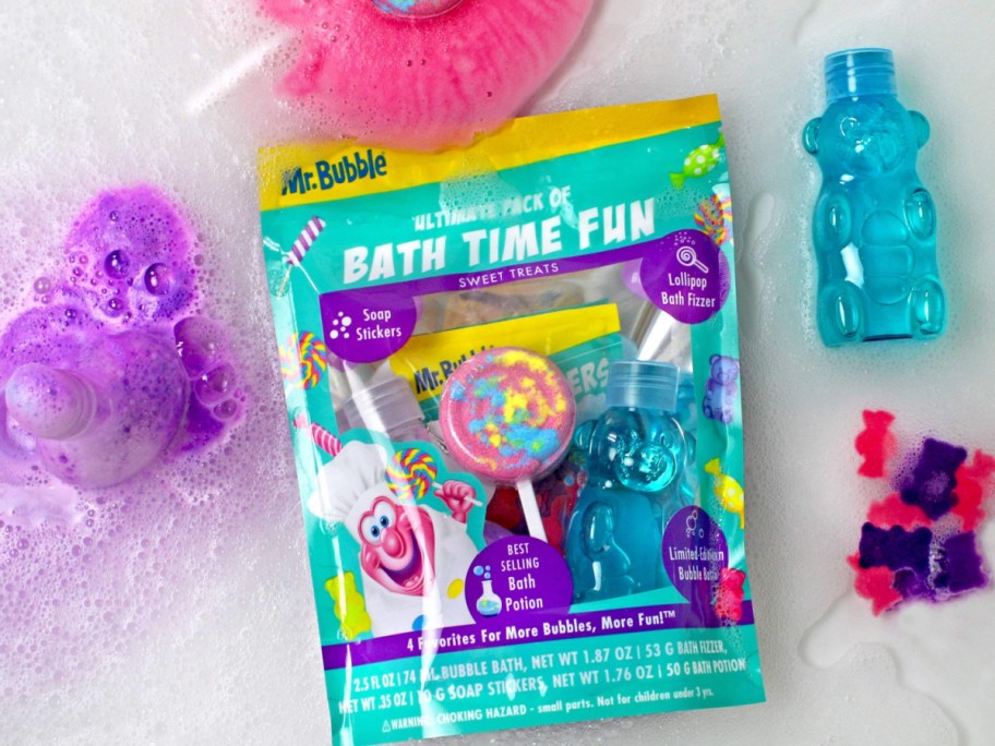 Mr. bubble bath time, fun package filled with bath toys and floating in bathtub next to bubble