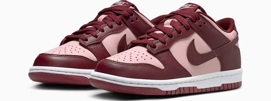 pair of dark red and pink nike sneakers