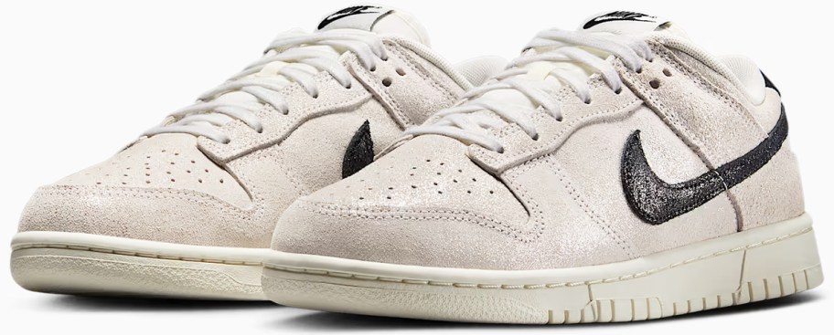 pair of taupe and black colored nike sneakers