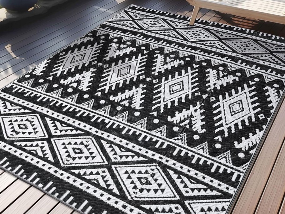 black and white boho print outdoor rug on deck