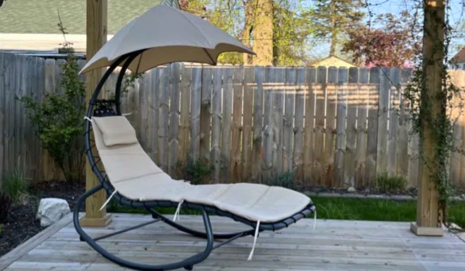 outdoor hanging chaise lounger on outdoor deck in beige