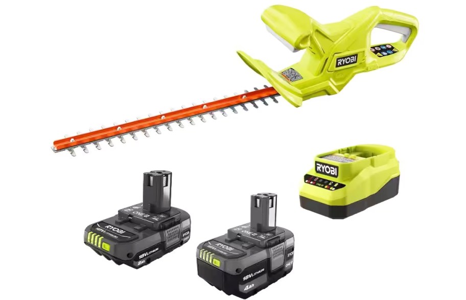 green hedge trimmer, two black batteries, and a charger