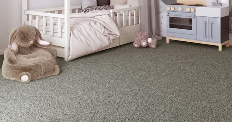 A gray carpet in a child's bedroom 